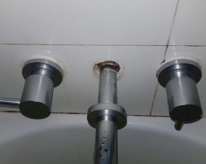 Gaps behind bath spout