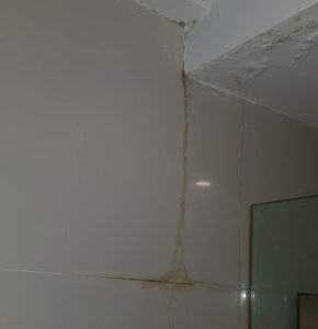 Damaged and water leaking from bathroom ceiling